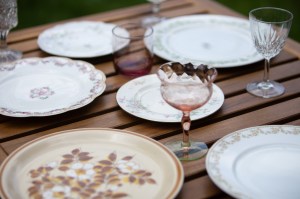 plates and glassware on a wood table