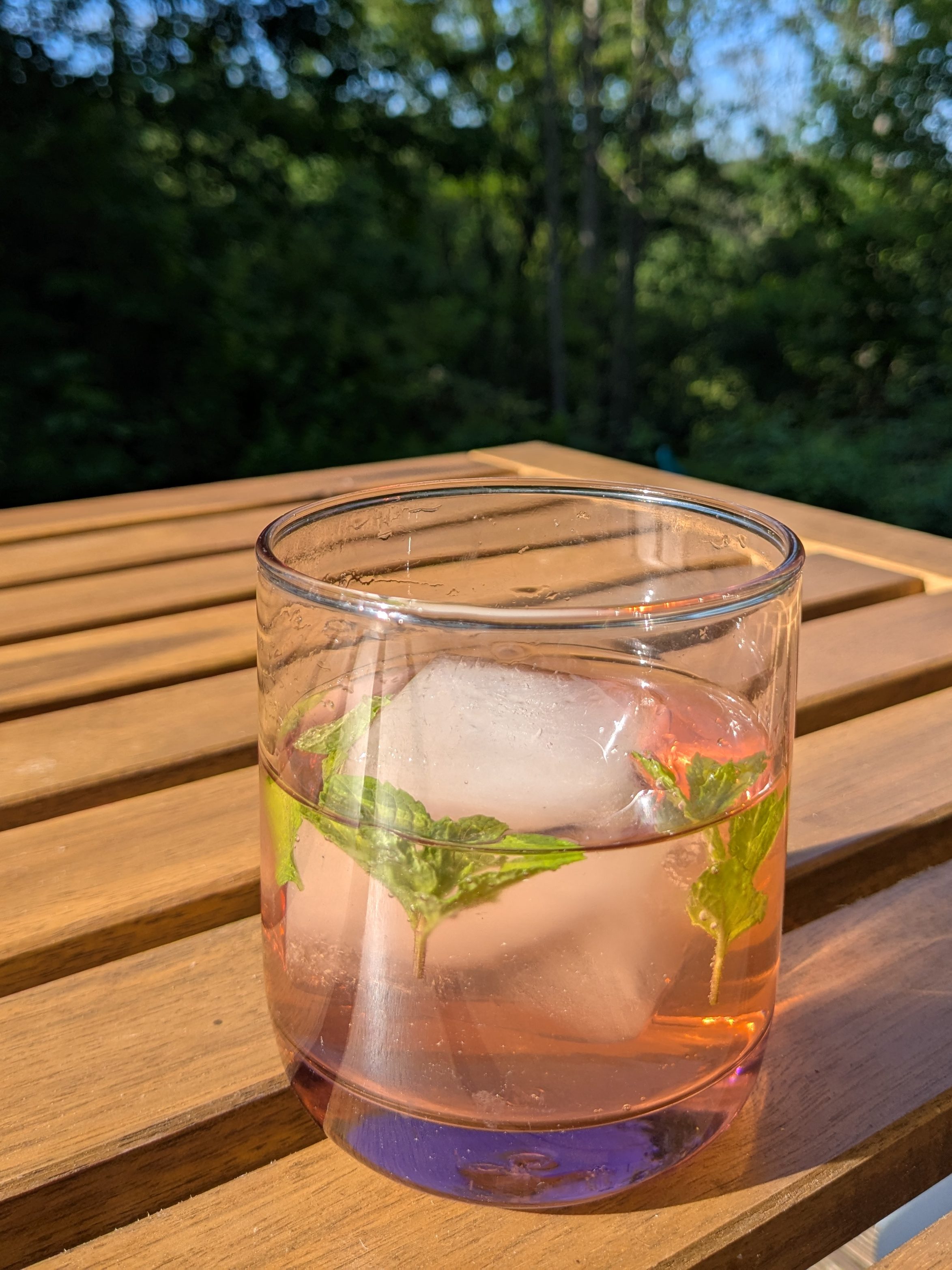 a drink in a pink vintage glass with mint