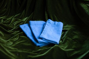 napkins folded on a velvet table cloth